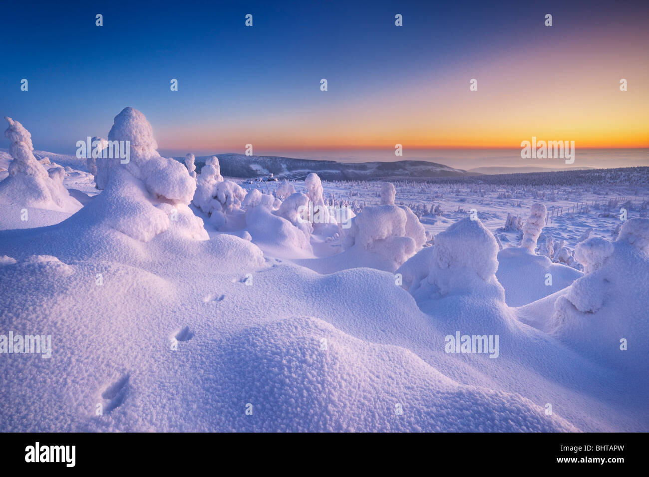 Winter snow landscape just after sunset, Karkonosze Mountains, Poland Stock Photo