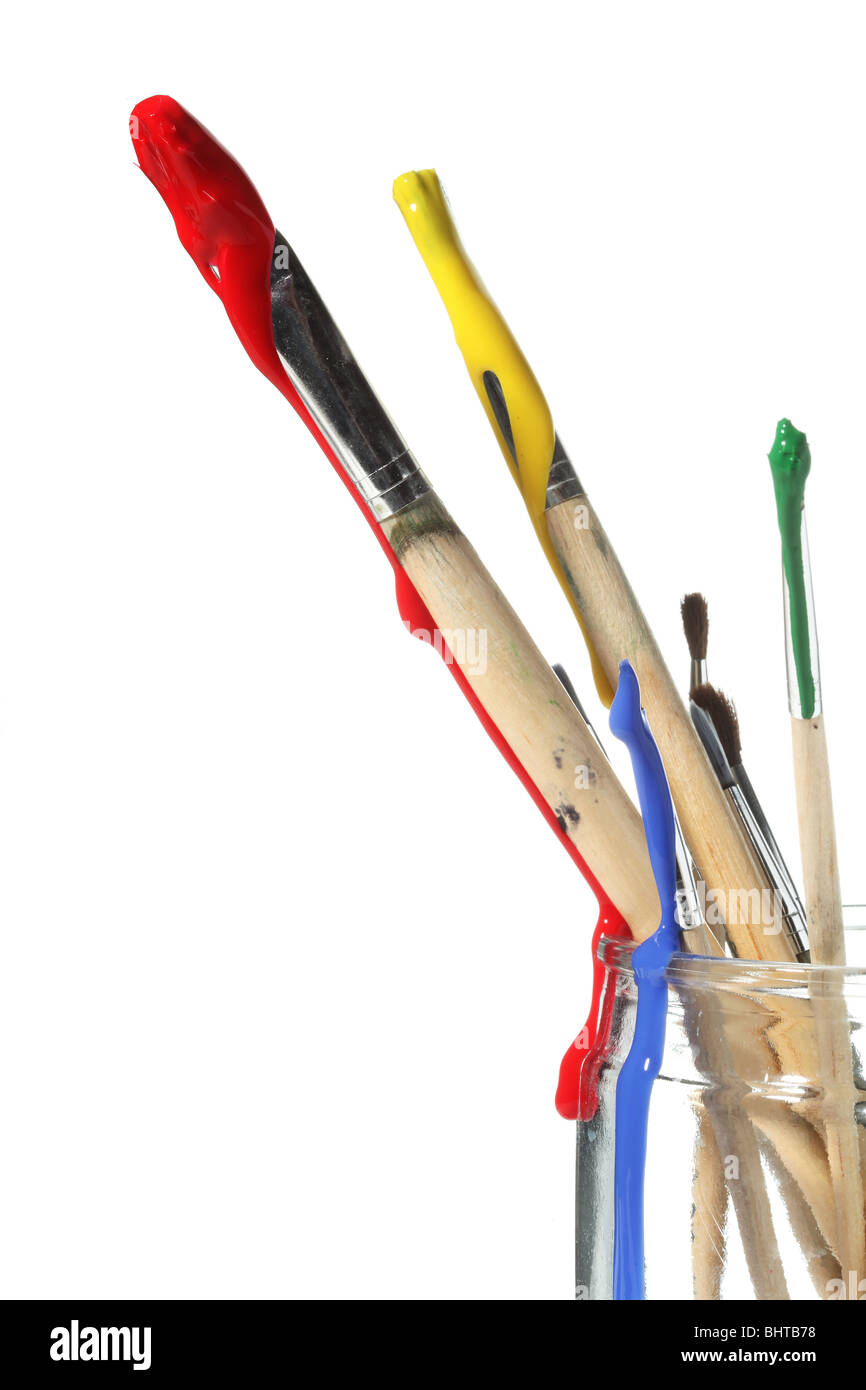 Paint brushes covered in paint Stock Photo