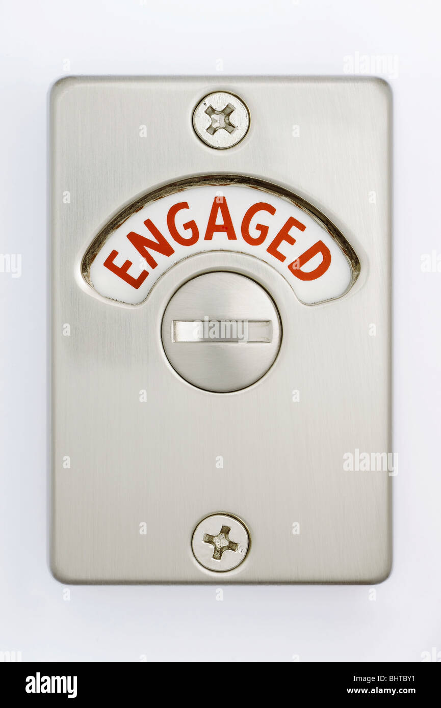 A toilet door lock showing engaged Stock Photo