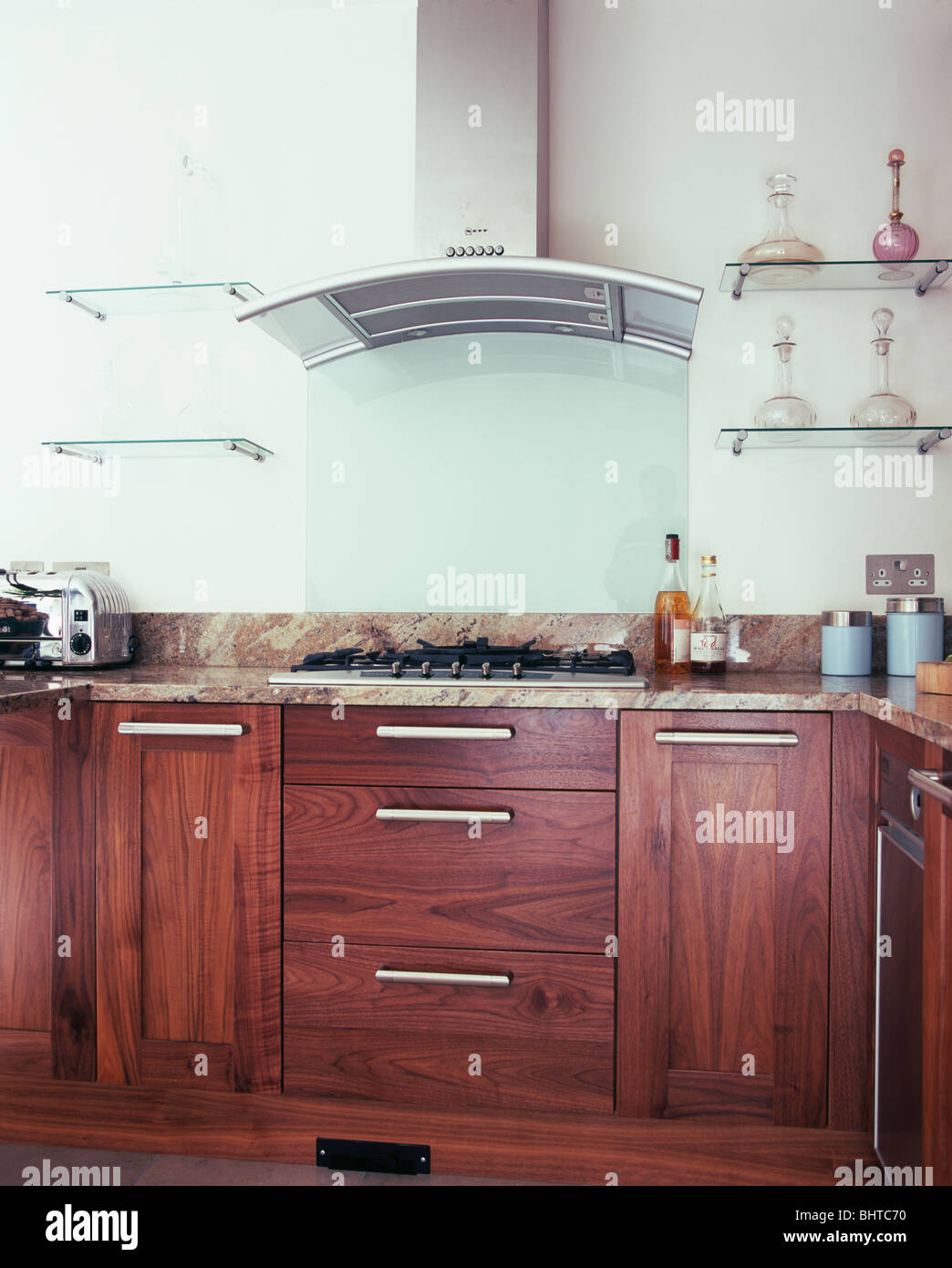 Glass Shelves On Either Side Of Extractor In Modern Kitchen With Dark Stock Photo Alamy