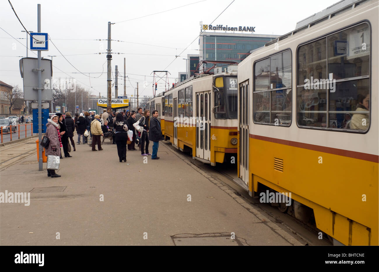 People waiting to board trams in Budapest, Hungary, Stock Photo