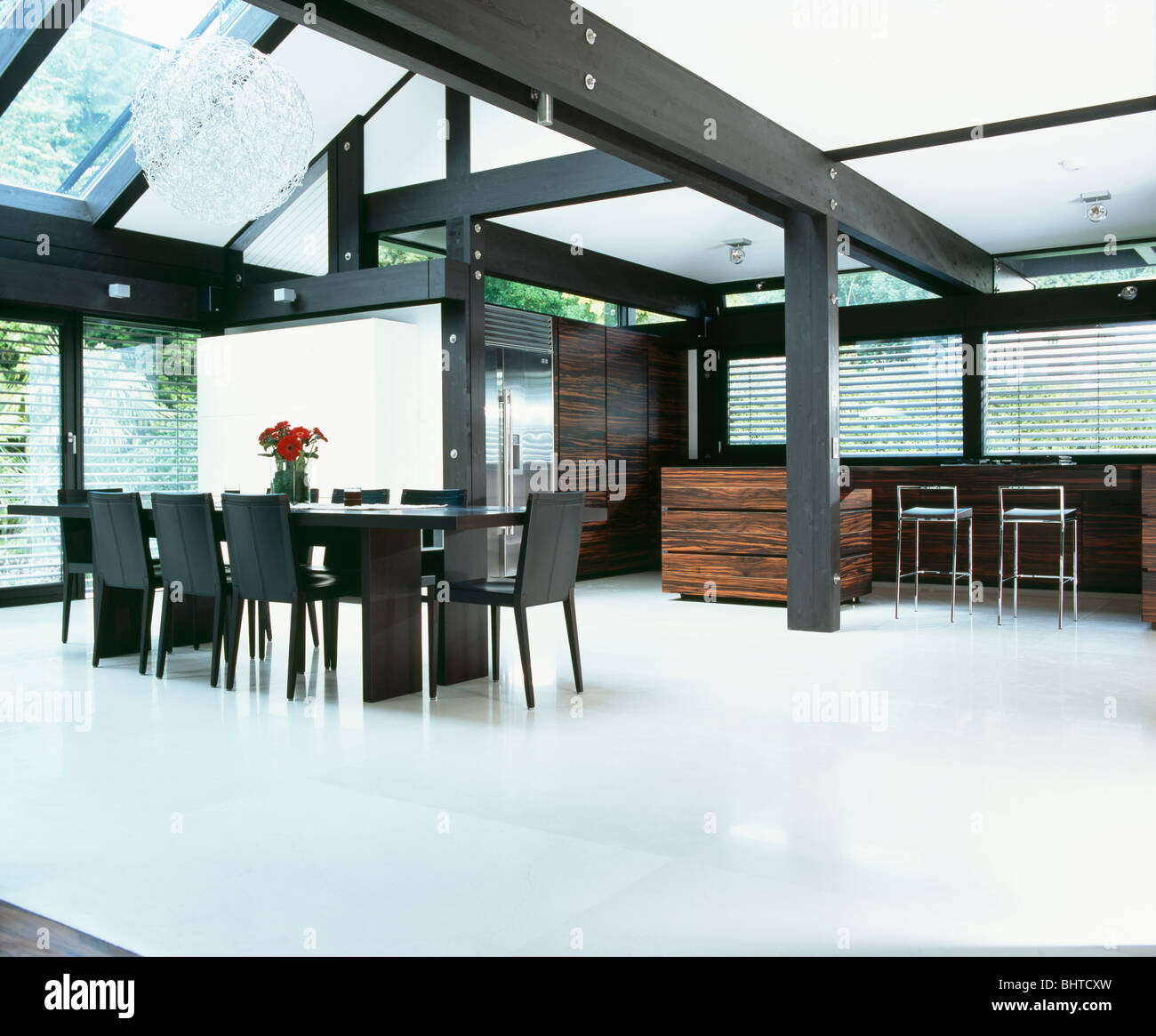 White Flooring And Black Beams In Large White Dining Room