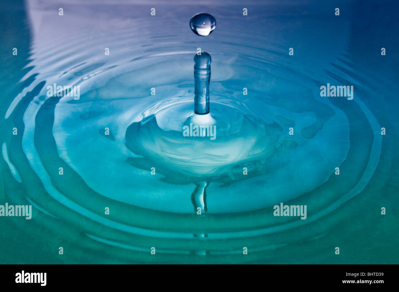 A drop of water hitting the surface Stock Photo Alamy