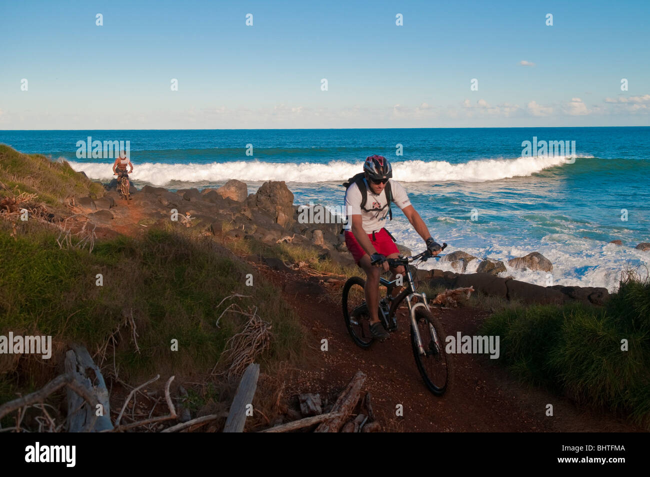 Mountain biking along the Kauai shoreline, Hawaii, USA Stock Photo Alamy