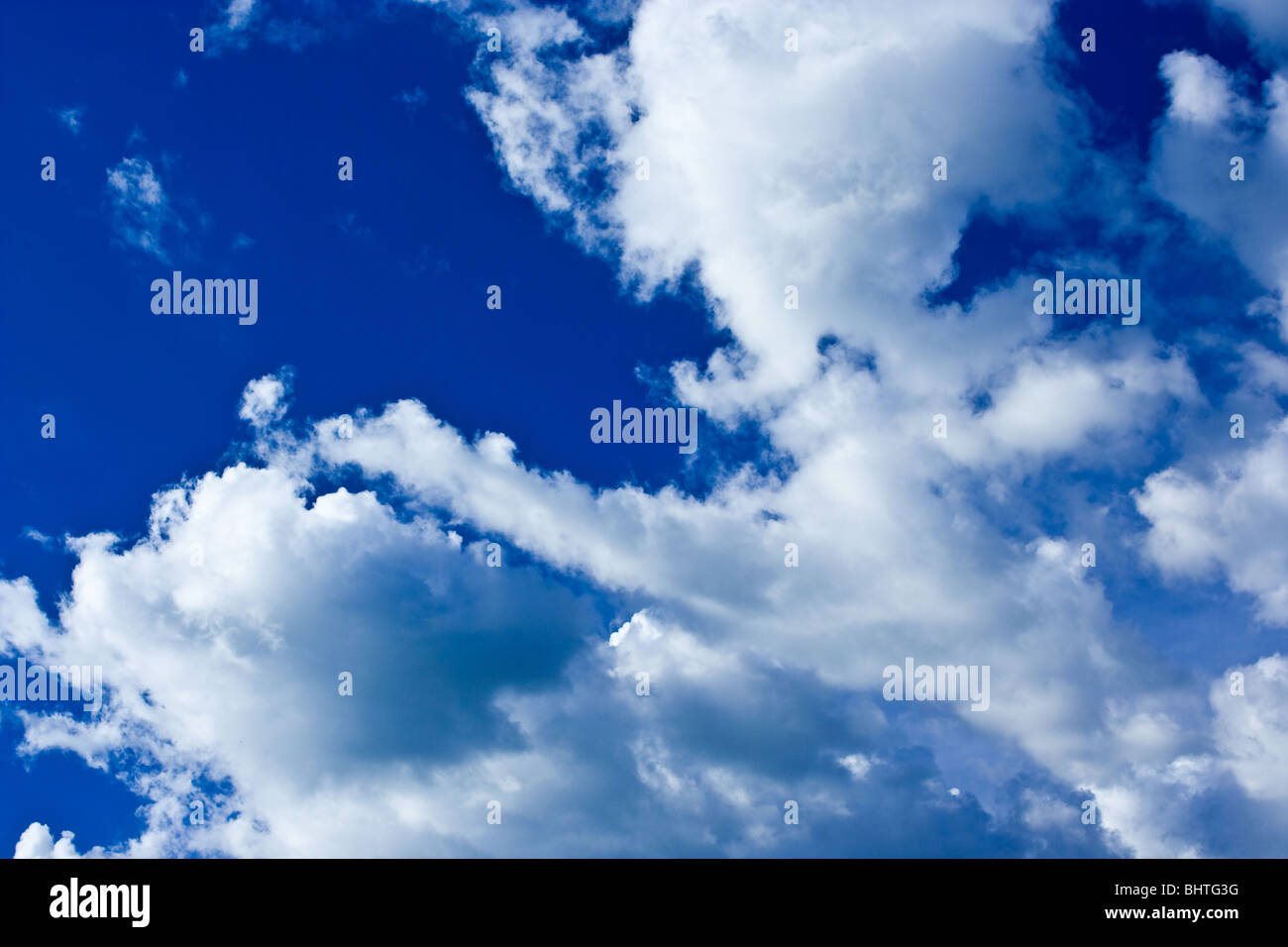 Background with beautiful blue sky and fluffy clouds Stock Photo - Alamy