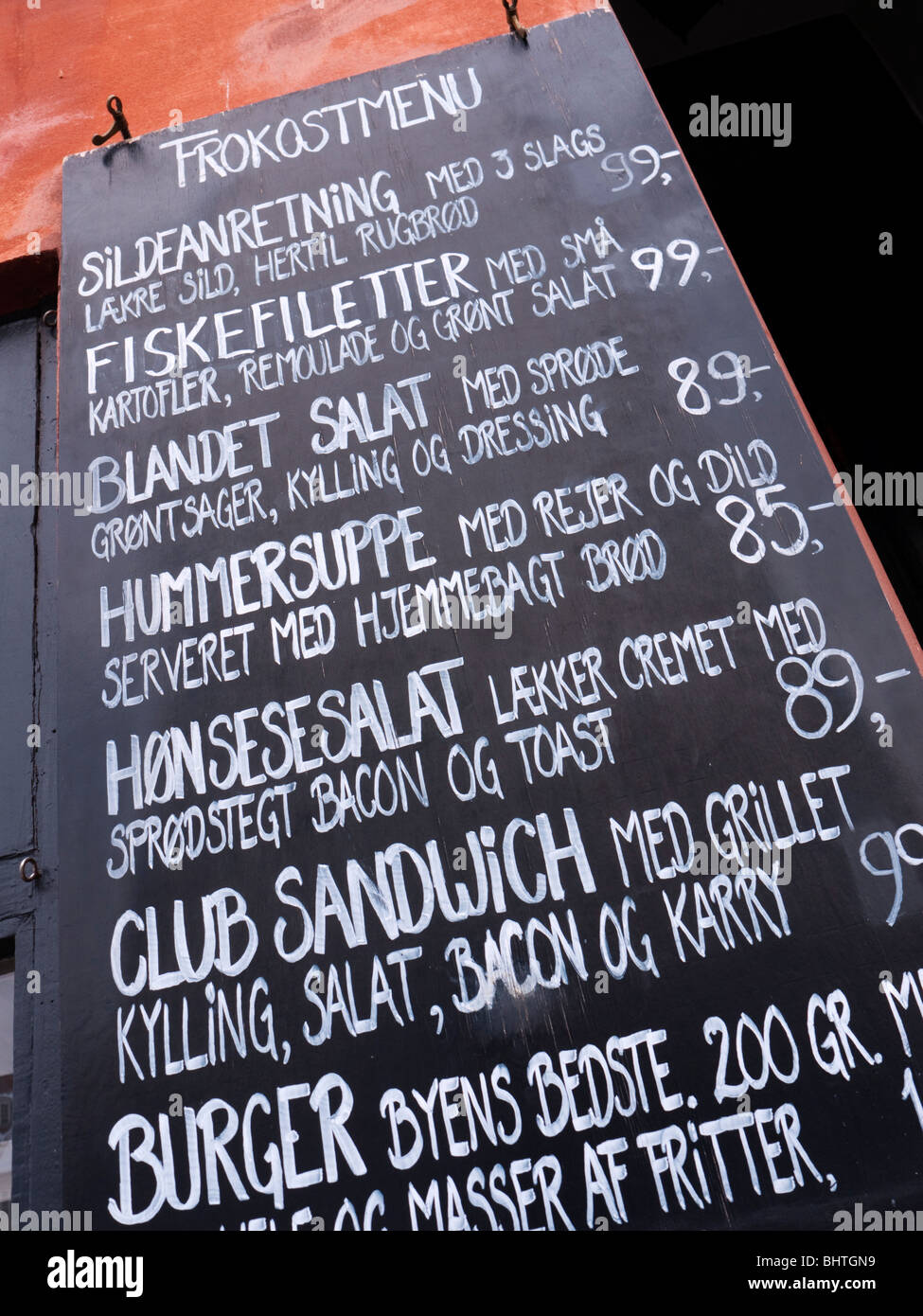 Menu board outside restaurant in Nyhavn district of Copenhagen Denmark Stock Photo
