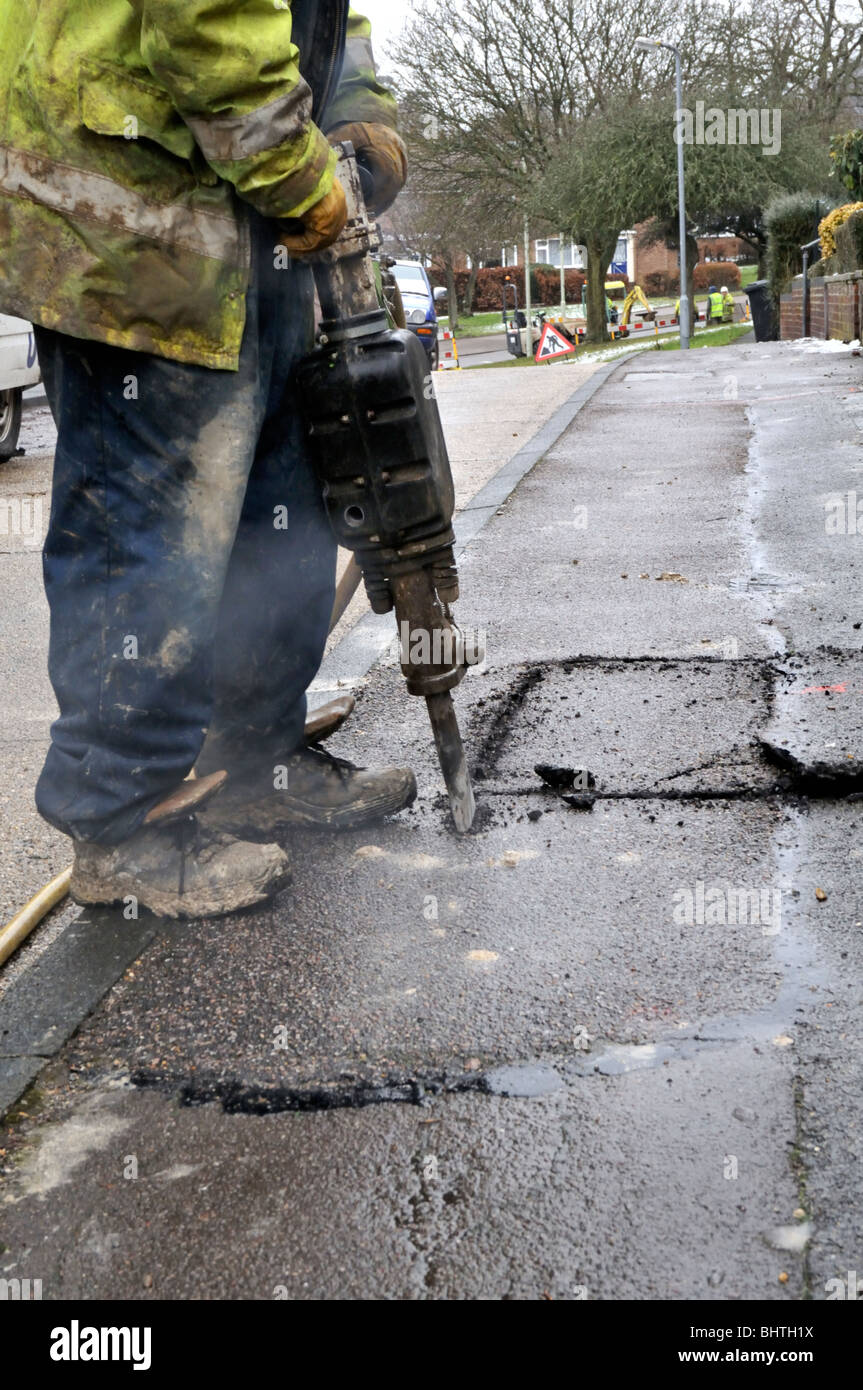 Digging up the pavement to replace gas pipe Stock Photo Alamy
