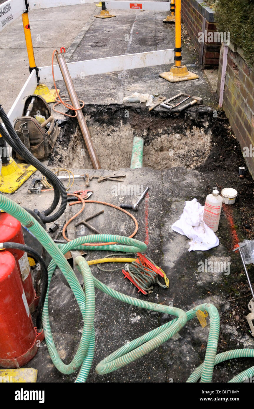 Digging up the pavement to replace gas pipe Stock Photo Alamy