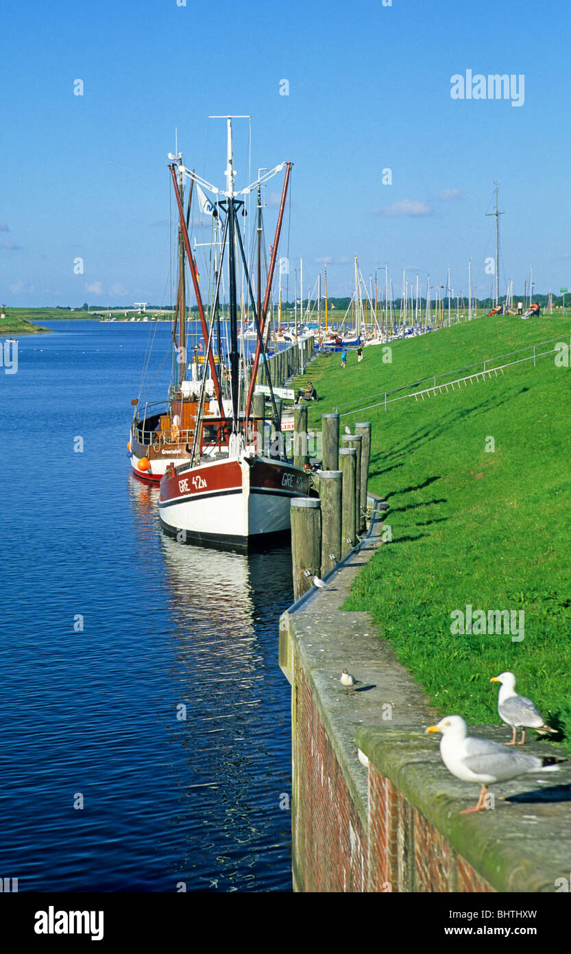 fishing smacks at the harbour of Greetsiel, East Friesland, North Sea Coast, Lower Saxony, Germany Stock Photo