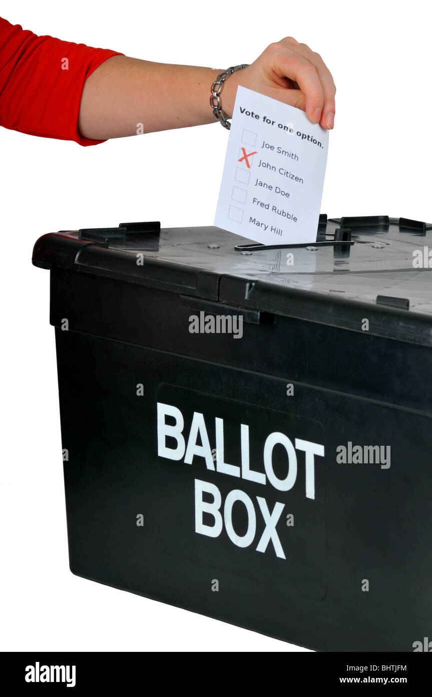 Ballot box, hand placing a vote into a ballot box, voting with ballot box Stock Photo