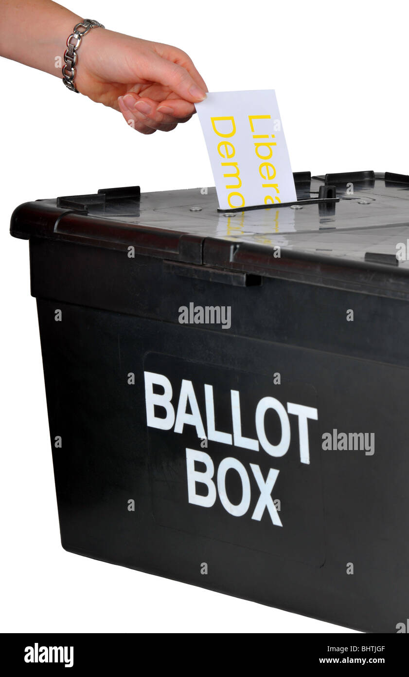 Ballot box, hand placing a vote for Liberal Democrats into a ballot box, voting with ballot box Stock Photo
