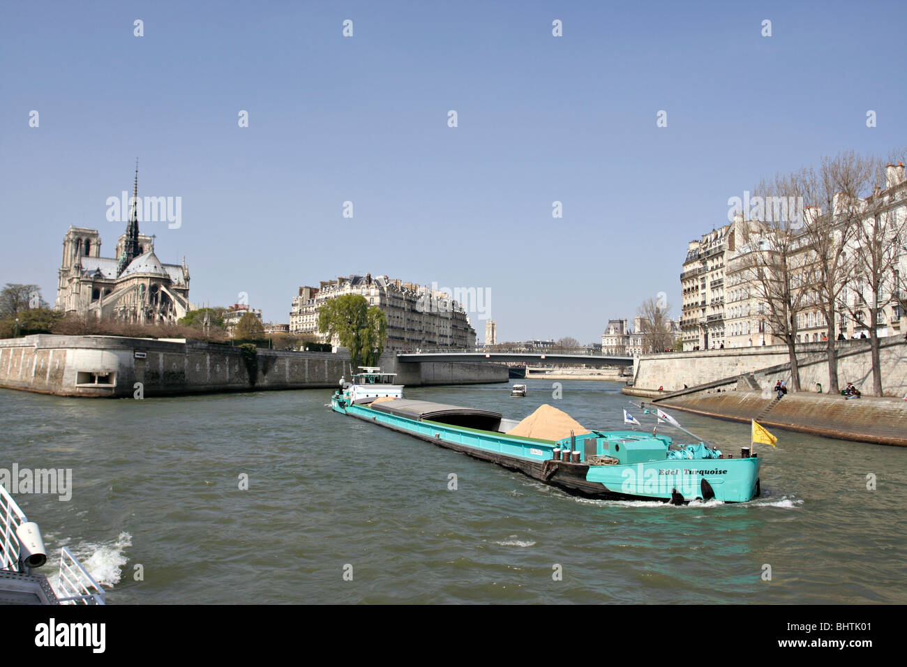 Boat carrying sand on River Seine in Paris, France. Stock Photo