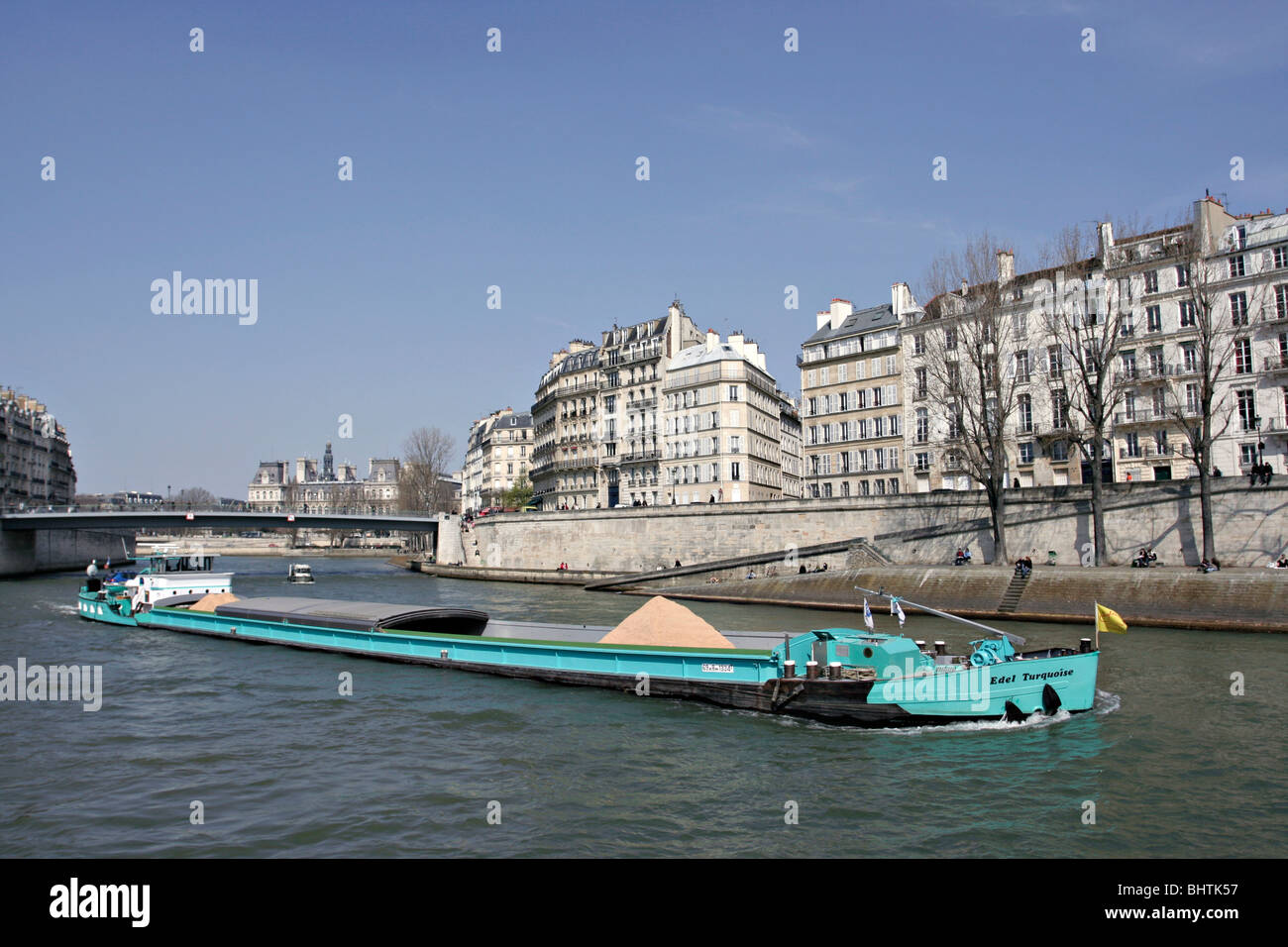 Boat carrying sand on River Seine in Paris, France. Stock Photo