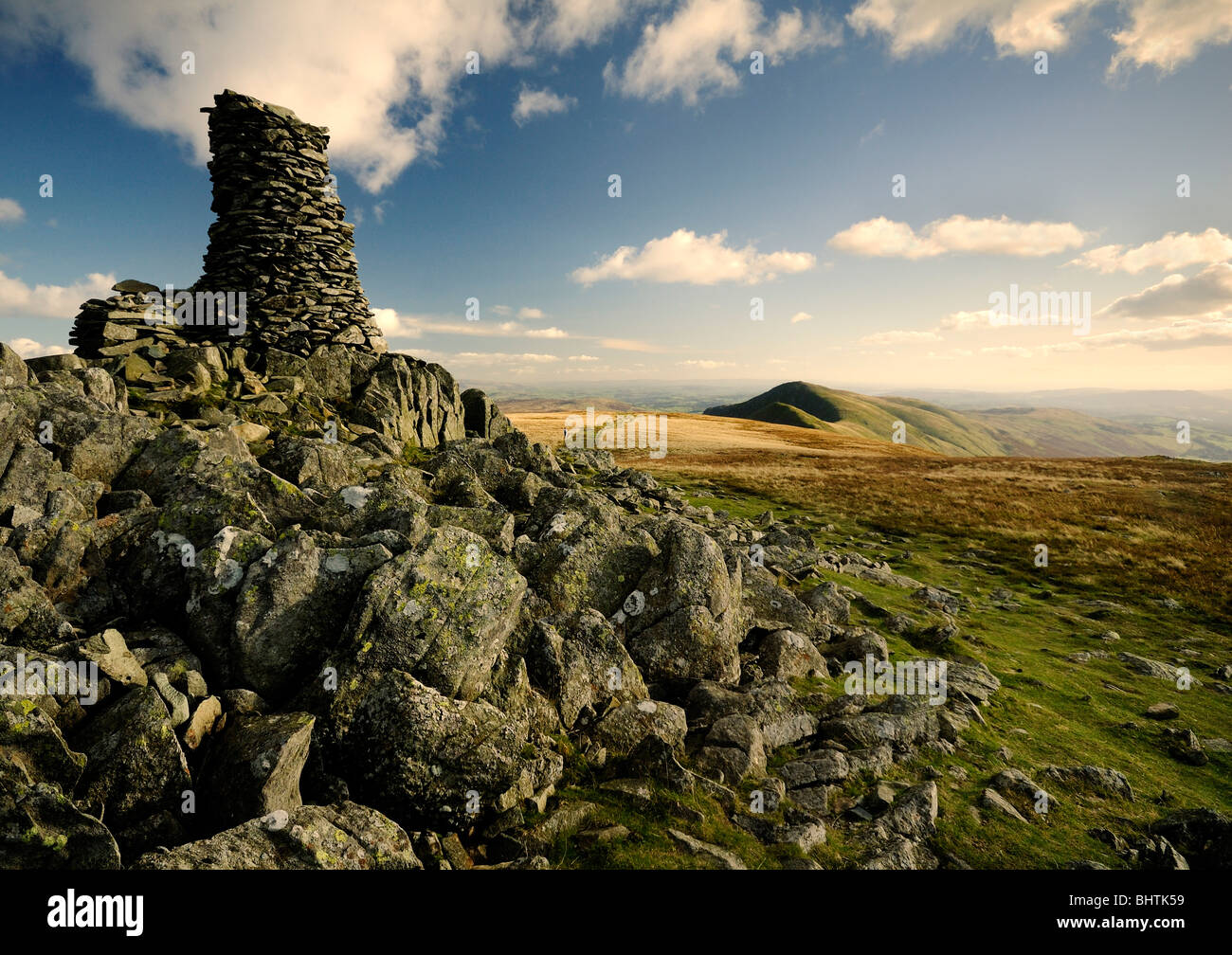 Cumbrian hill, summit of  'High Street' in the English lakes region with blue sky and lower hills in the distance Stock Photo