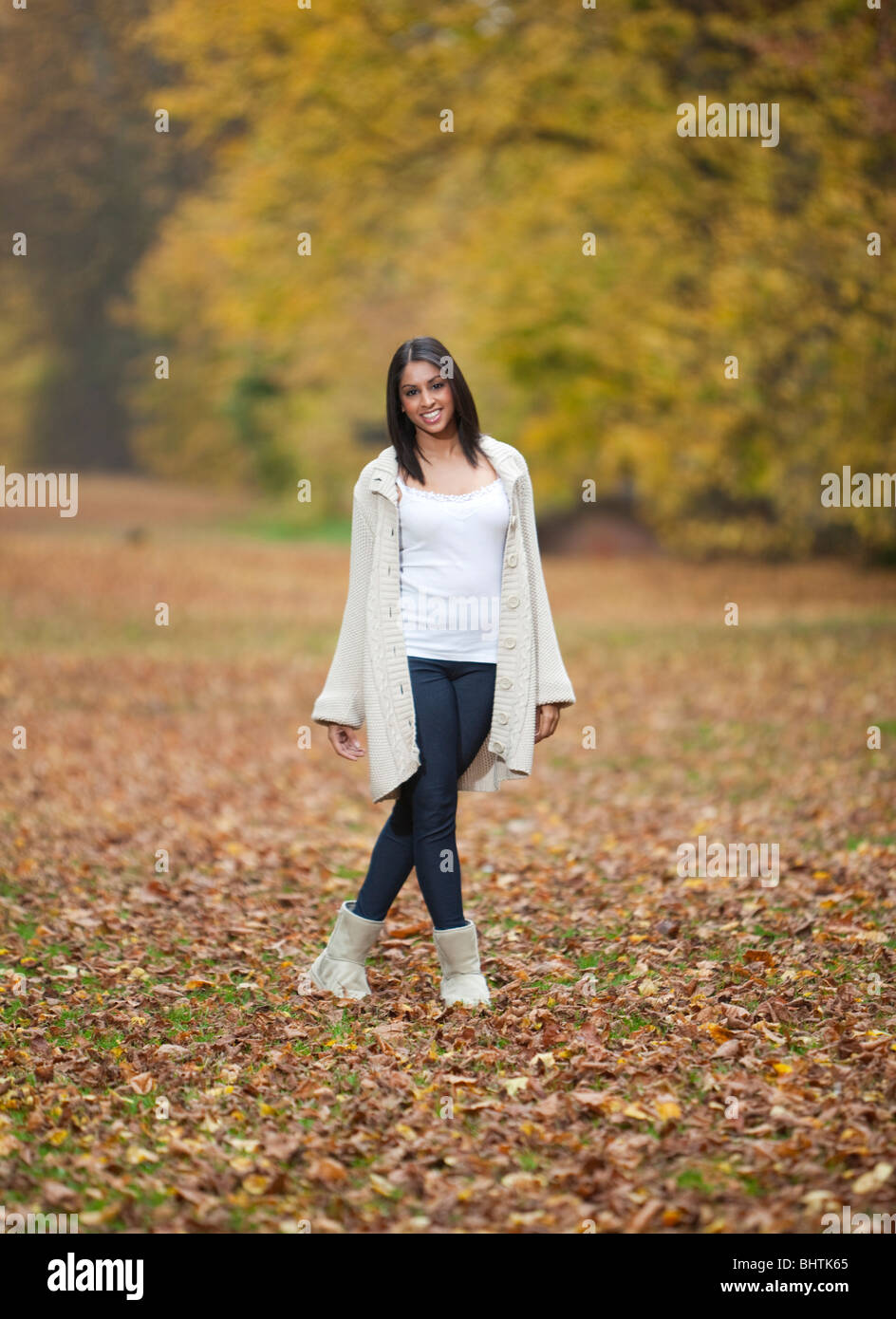 young Asian / Indian woman walking in a park Stock Photo: 28201437 - Alamy