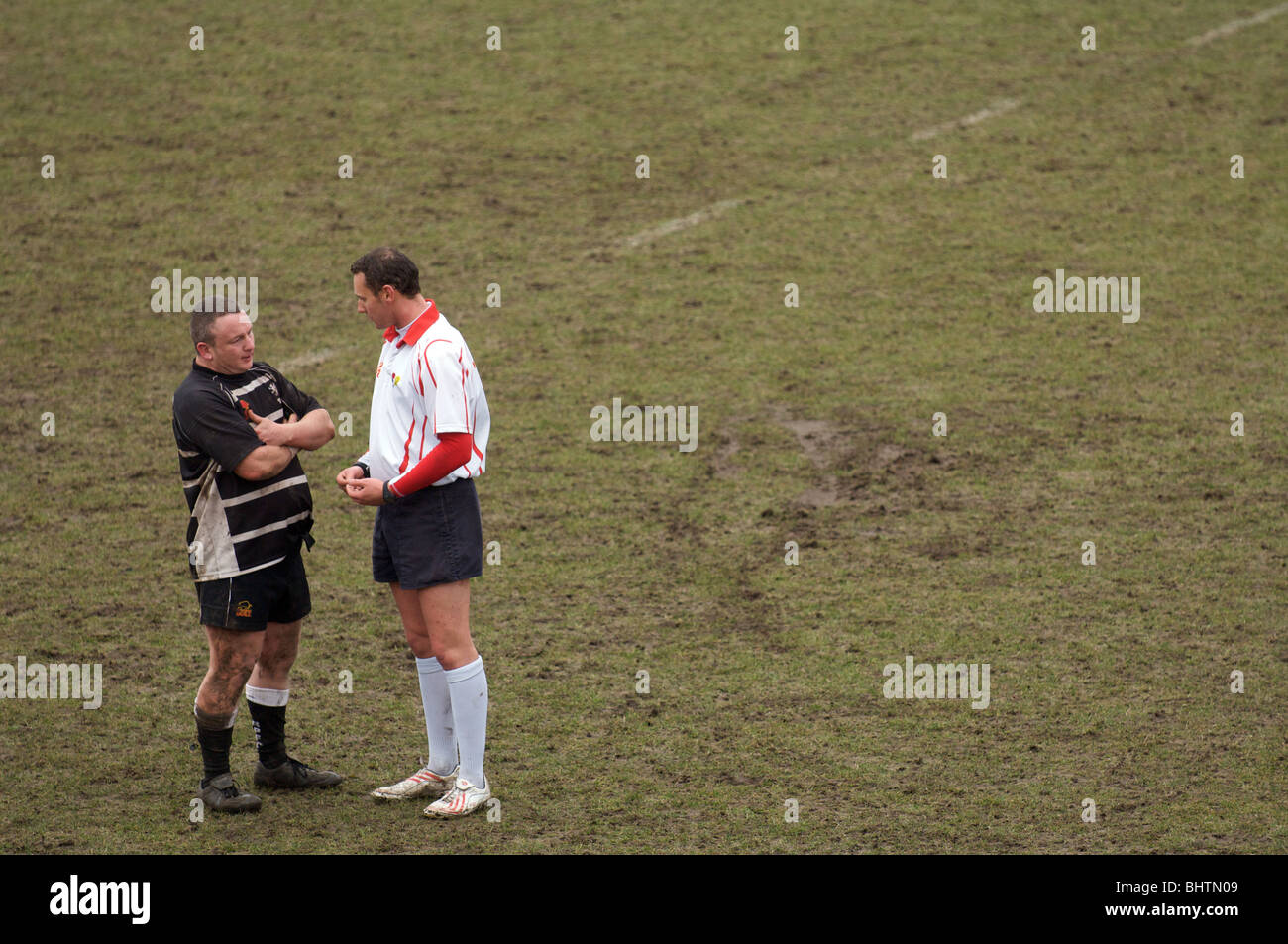 rugby referee reprimanding a  broughton park player Stock Photo