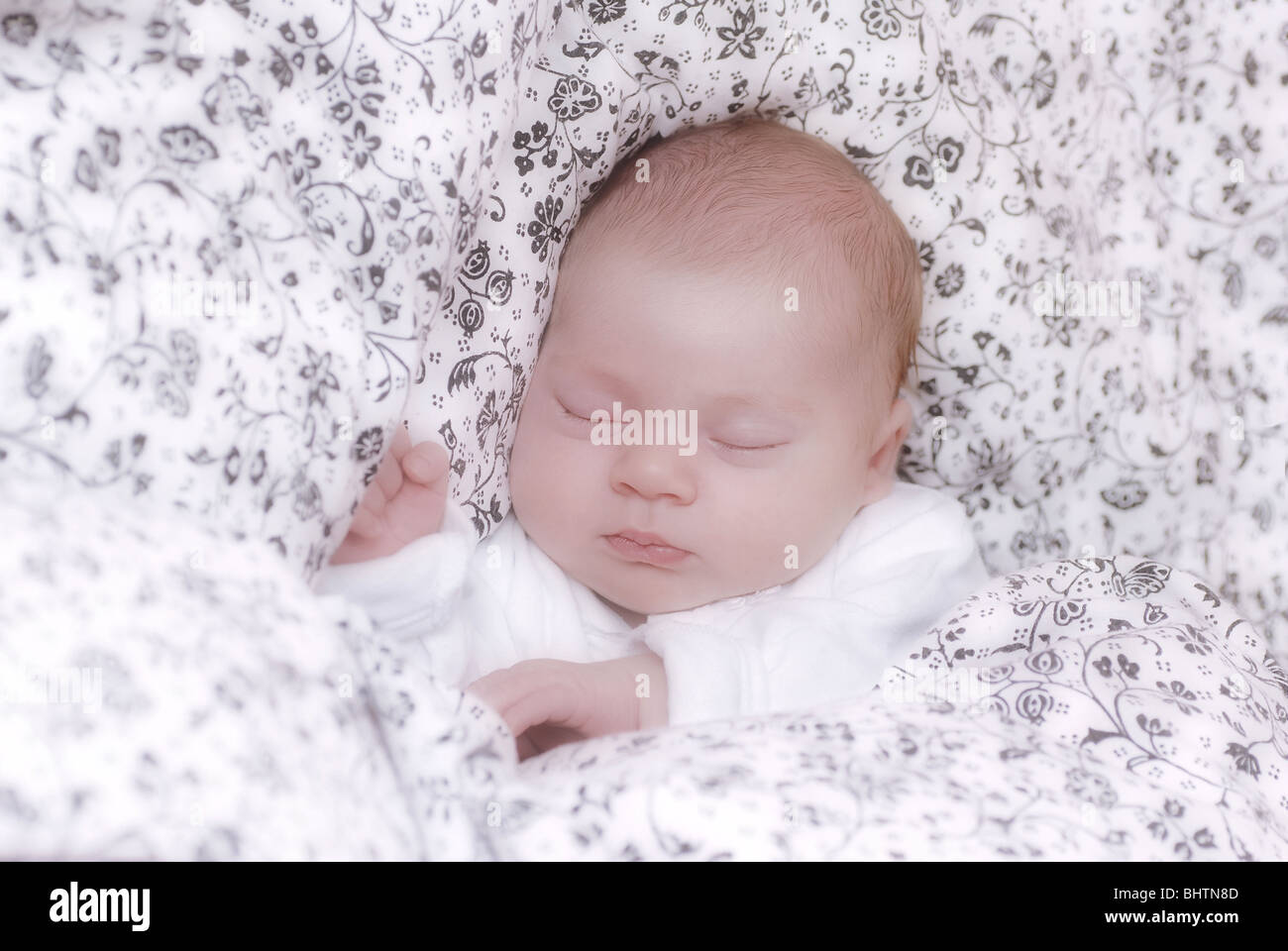 BABY ASLEEP IN A BED Stock Photo