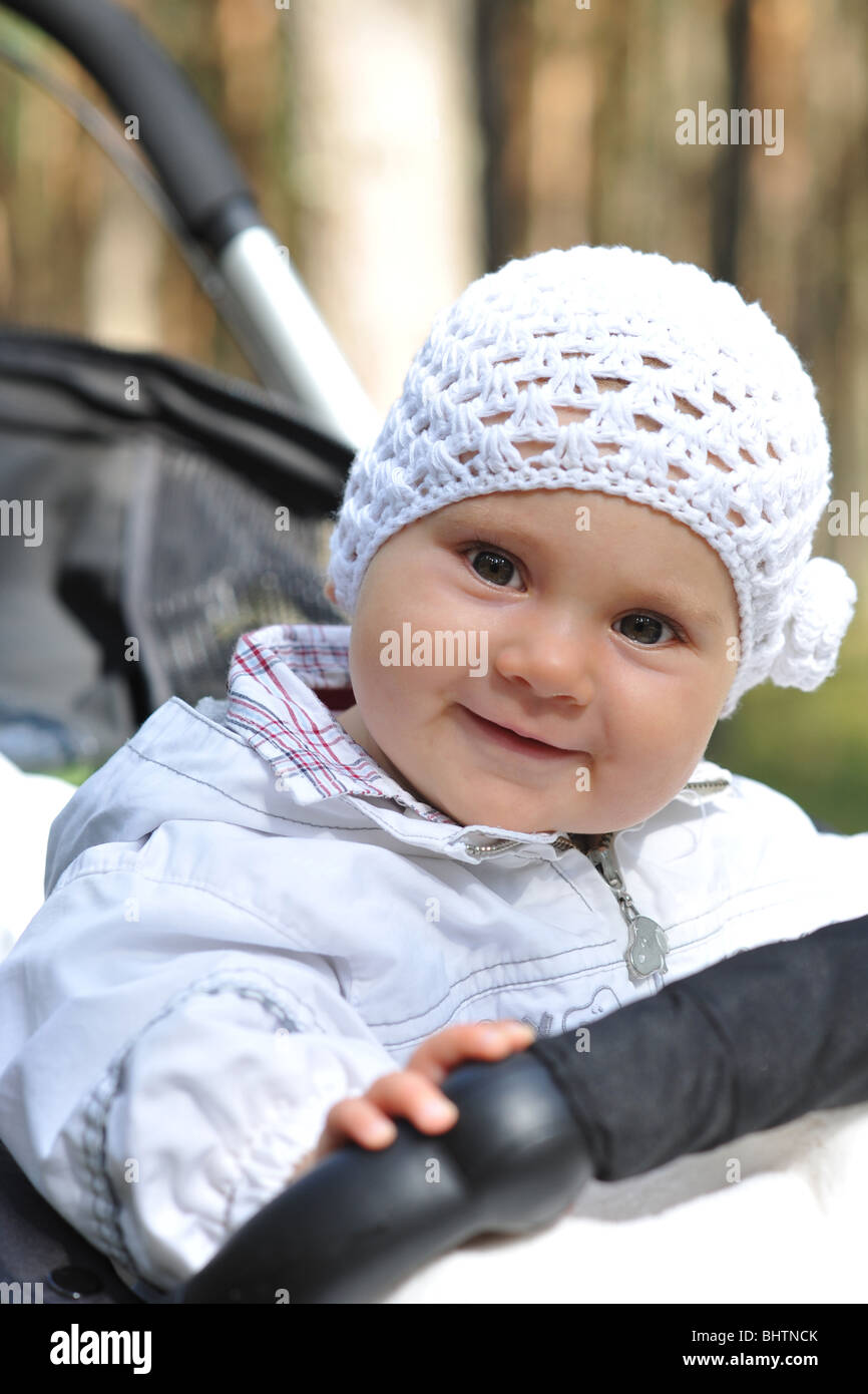 Portrait of a cute baby in a cart Stock Photo