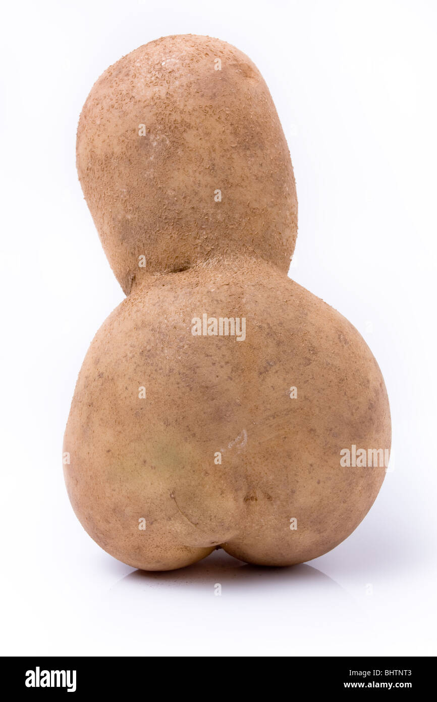 Funny potato shaped like a little mans head and body rear view against white background. Stock Photo