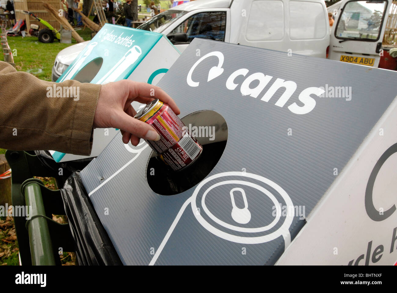 Can recycling bin in use at a country fair Stock Photo Alamy