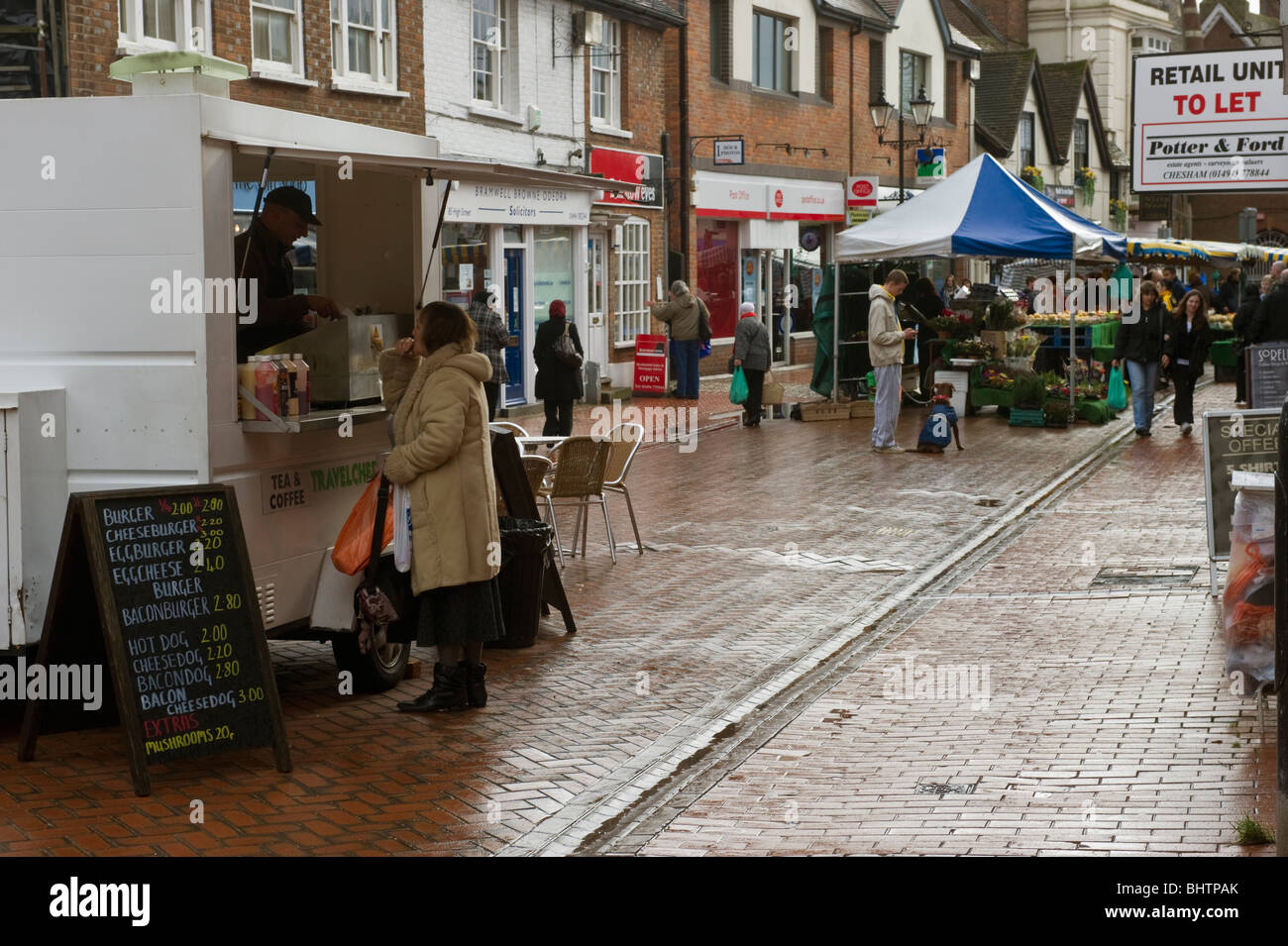 Stalls, shops in a pedestrianised car free high street in ...