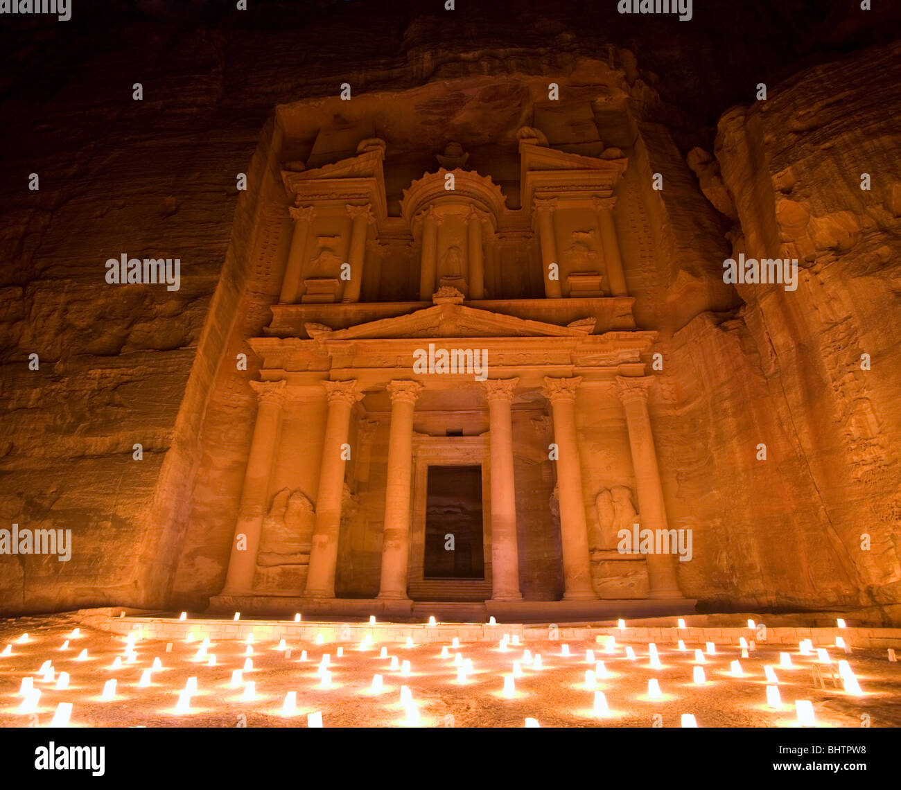 The Treasury or Al Khaznah lit up by candles for Petra by night in Wady Musa, Jordan. Stock Photo