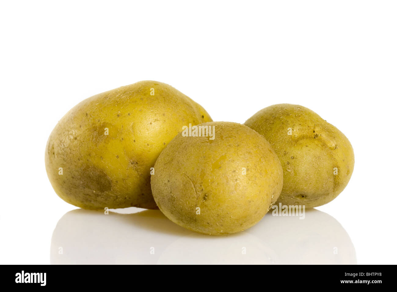 Potatoes on a white background Stock Photo - Alamy