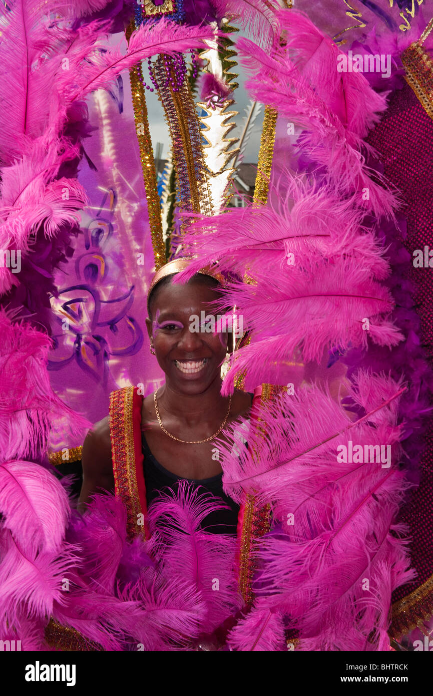 Black woman in ornate pink Caribbean carnival costume in Newham ...
