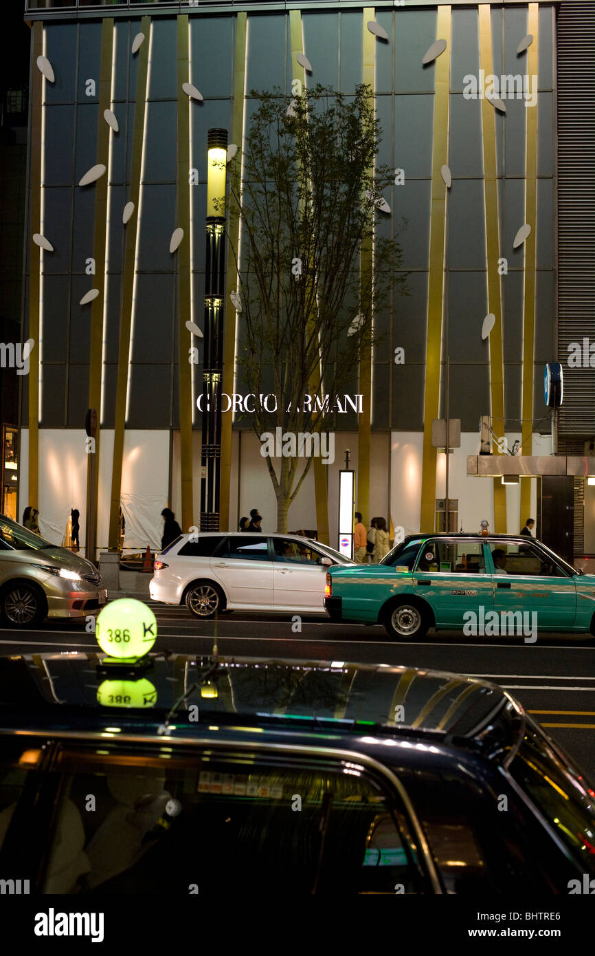 Nightime in the fashionable Ginza area of Tokyo . The district is the location of many designer fashion shops Stock Photo