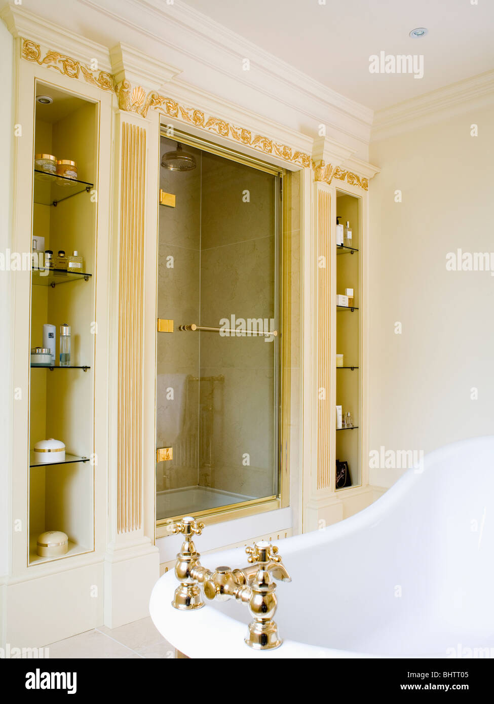 Narrow alcove shelving on either side of recessed shower unit in