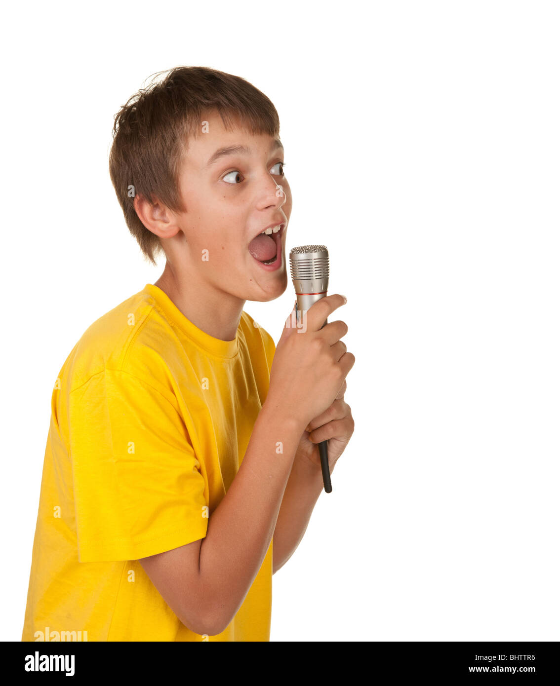 boy singing karaoke isolated on white background Stock Photo - Alamy