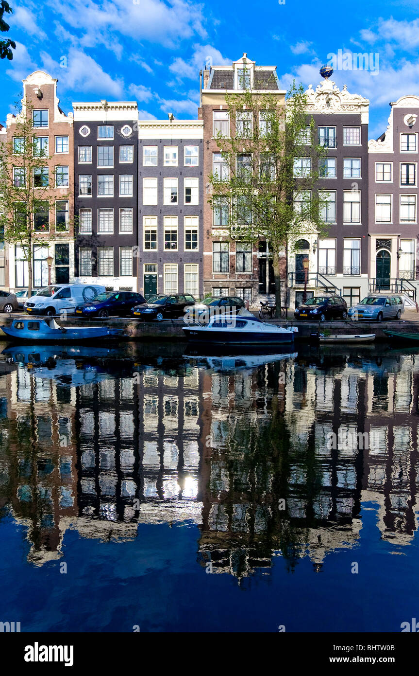 Buildings reflecting in a canal, Amsterdam, Holland Stock Photo
