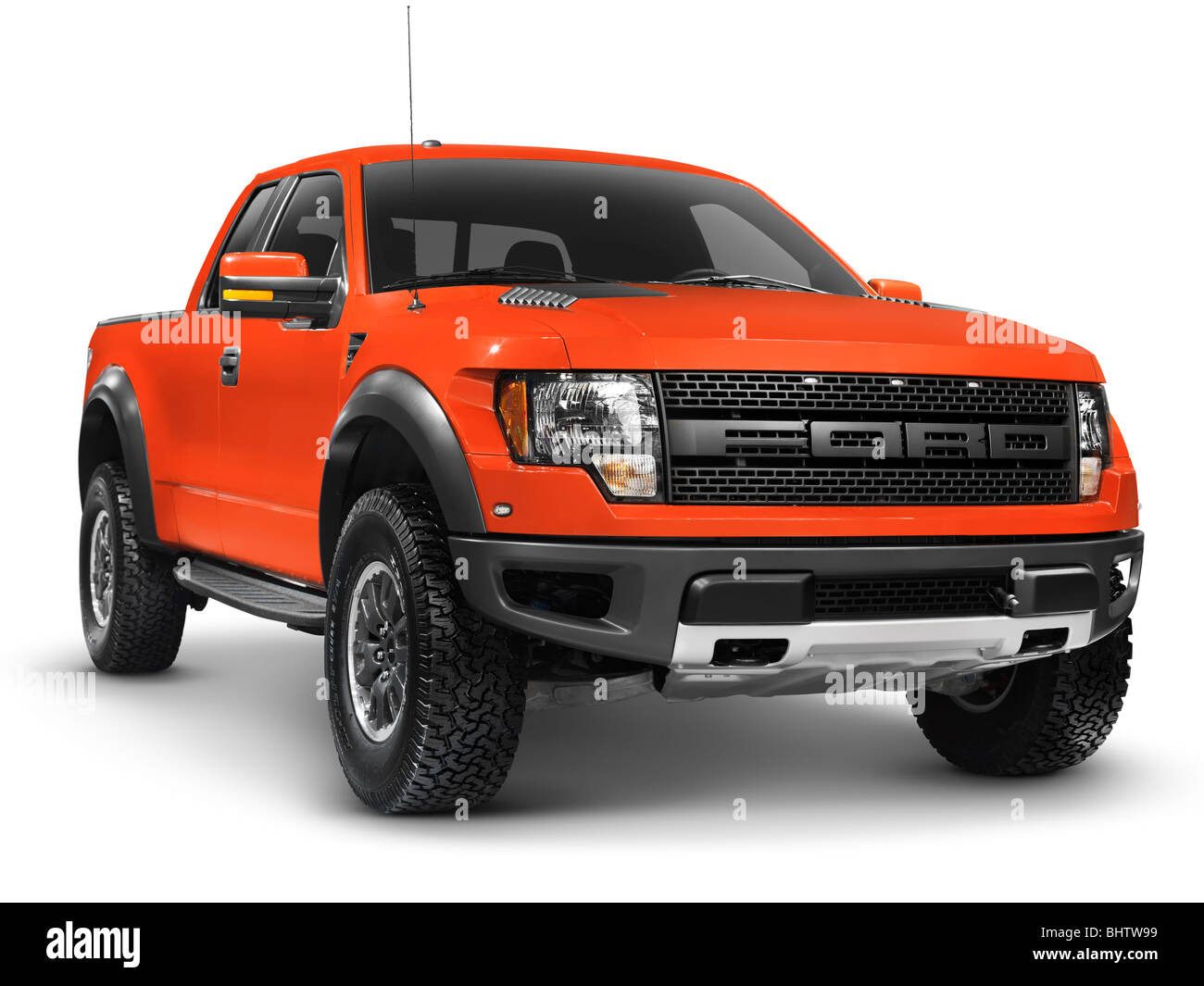 License and prints at MaximImages.com - Red 2010 Ford F-150 Raptor SVT truck isolated on white background with clipping path Stock Photo