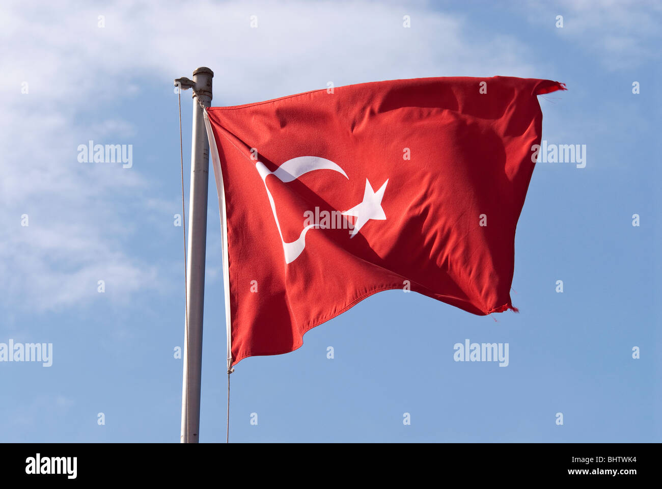 Turkish Flag Flying on a Flag Pole Stock Photo
