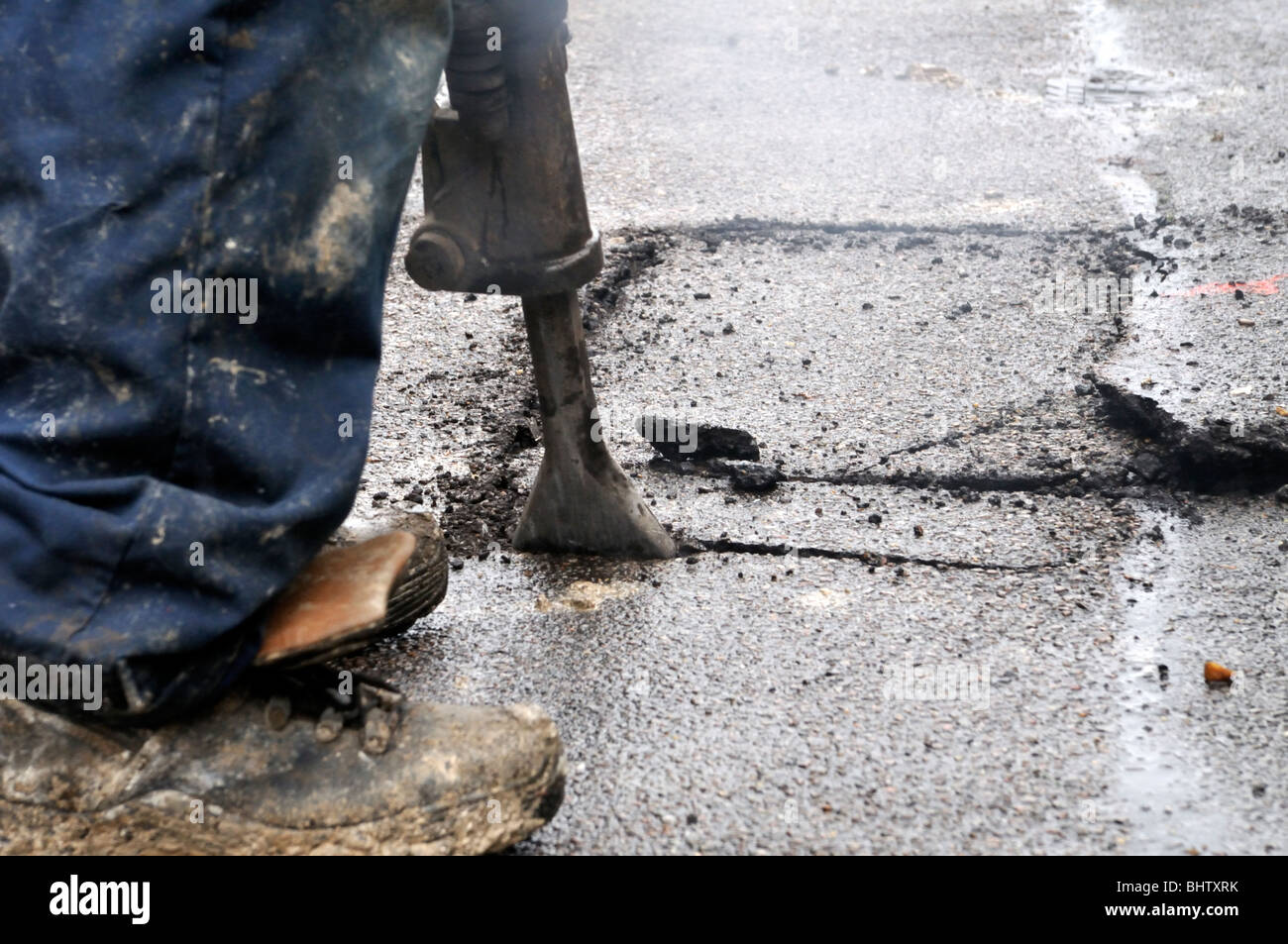 Digging up the pavement to replace gas pipe Stock Photo Alamy