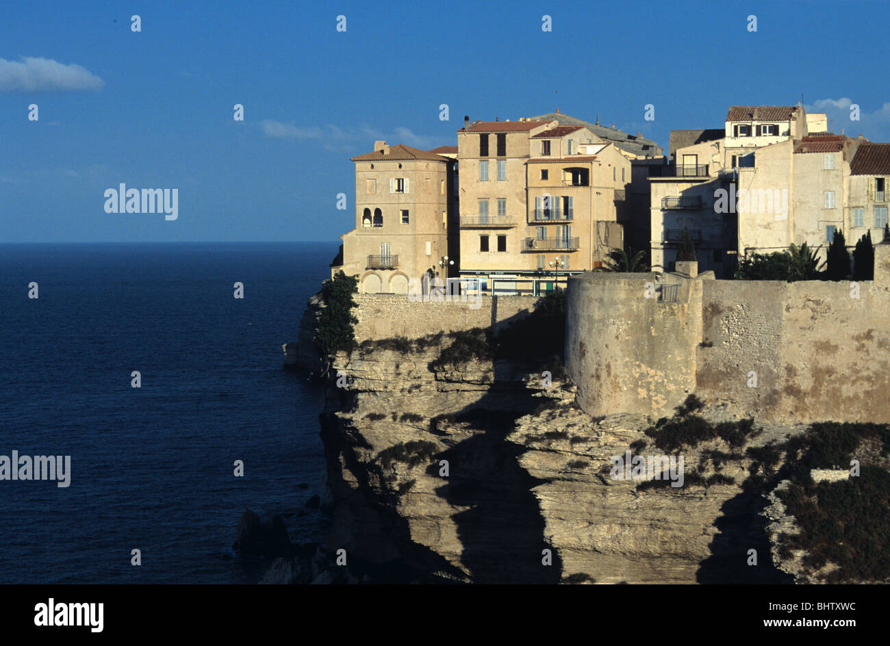 Bonifacio, Clifftop or Cliff Edge Houses overlooking the Bay or Bouches of Bonifacio, & Mediterranean Sea, Corsica, France Stock Photo
