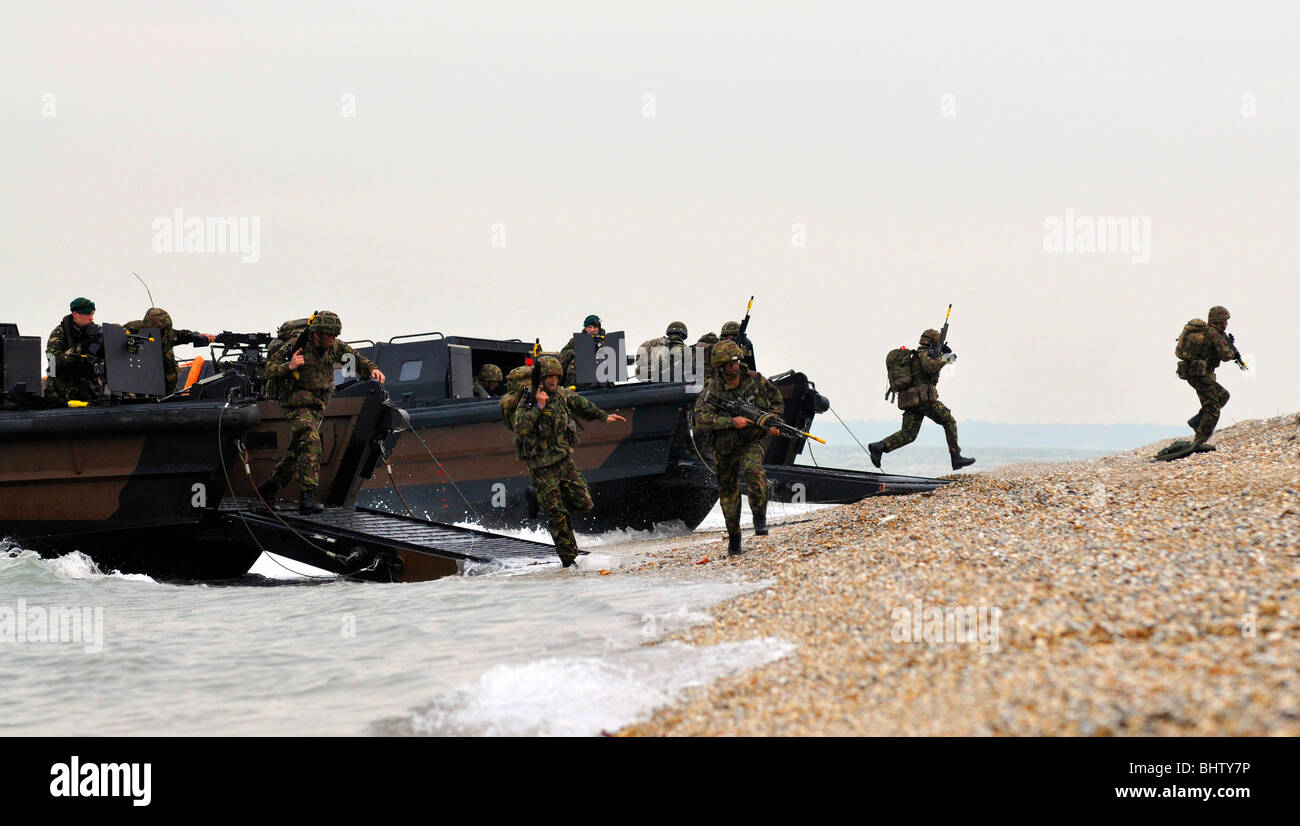 “Royal Marines' beach landing craft, commandos charge onto the beach from their landing craft Stock Photo