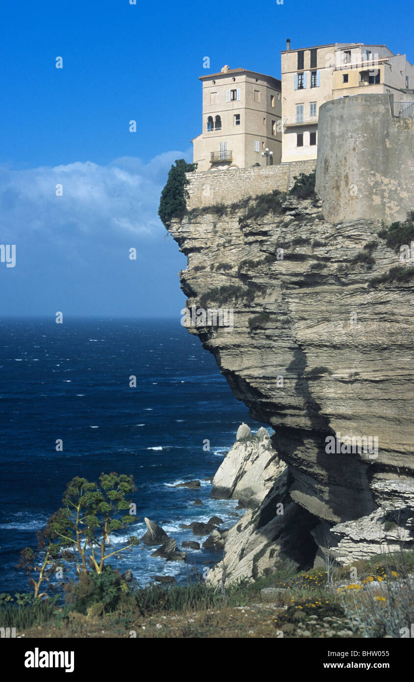 Clifftop Houses Perched on Edge of Limestone Cliffs & Medieterranean Sea, Bonifacio, Corsica, France Stock Photo