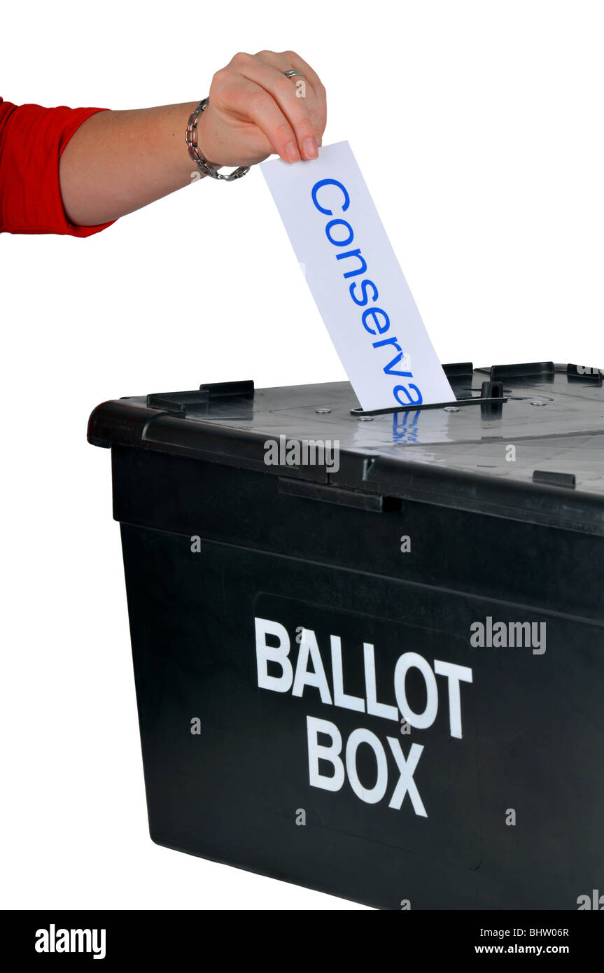 Ballot box, hand placing a Conservative vote into a ballot box, voting with ballot box Stock Photo