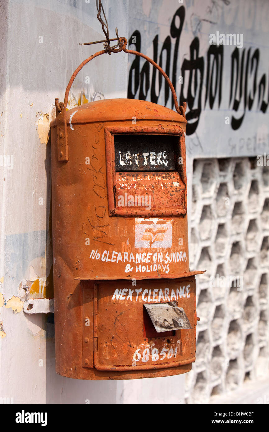 India, Kerala backwaters, Chennamkary, postal box hanging on riverside wall Stock Photo