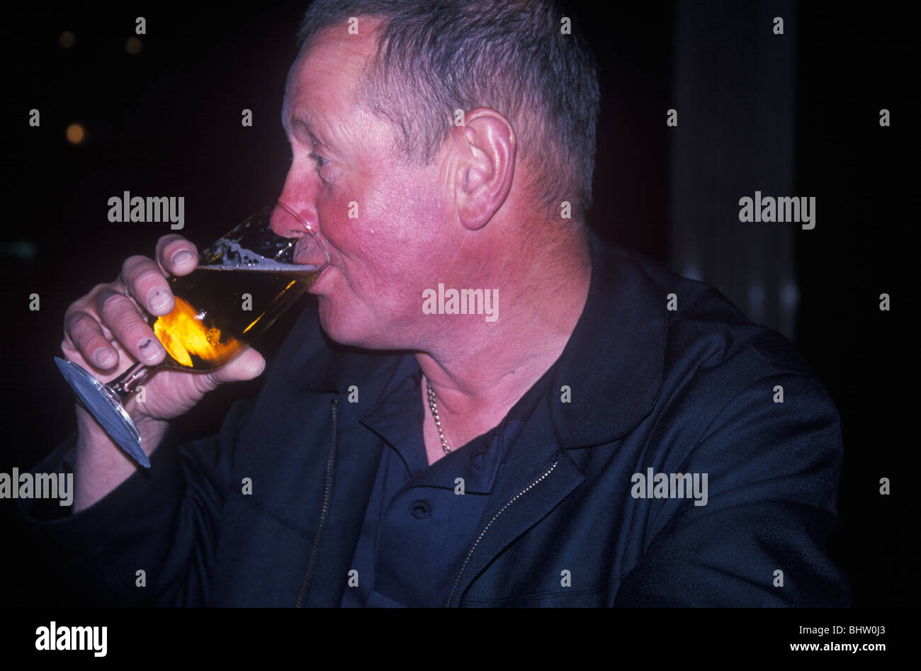 man with flushed red face from alcohol drinking lager Stock Photo - Alamy