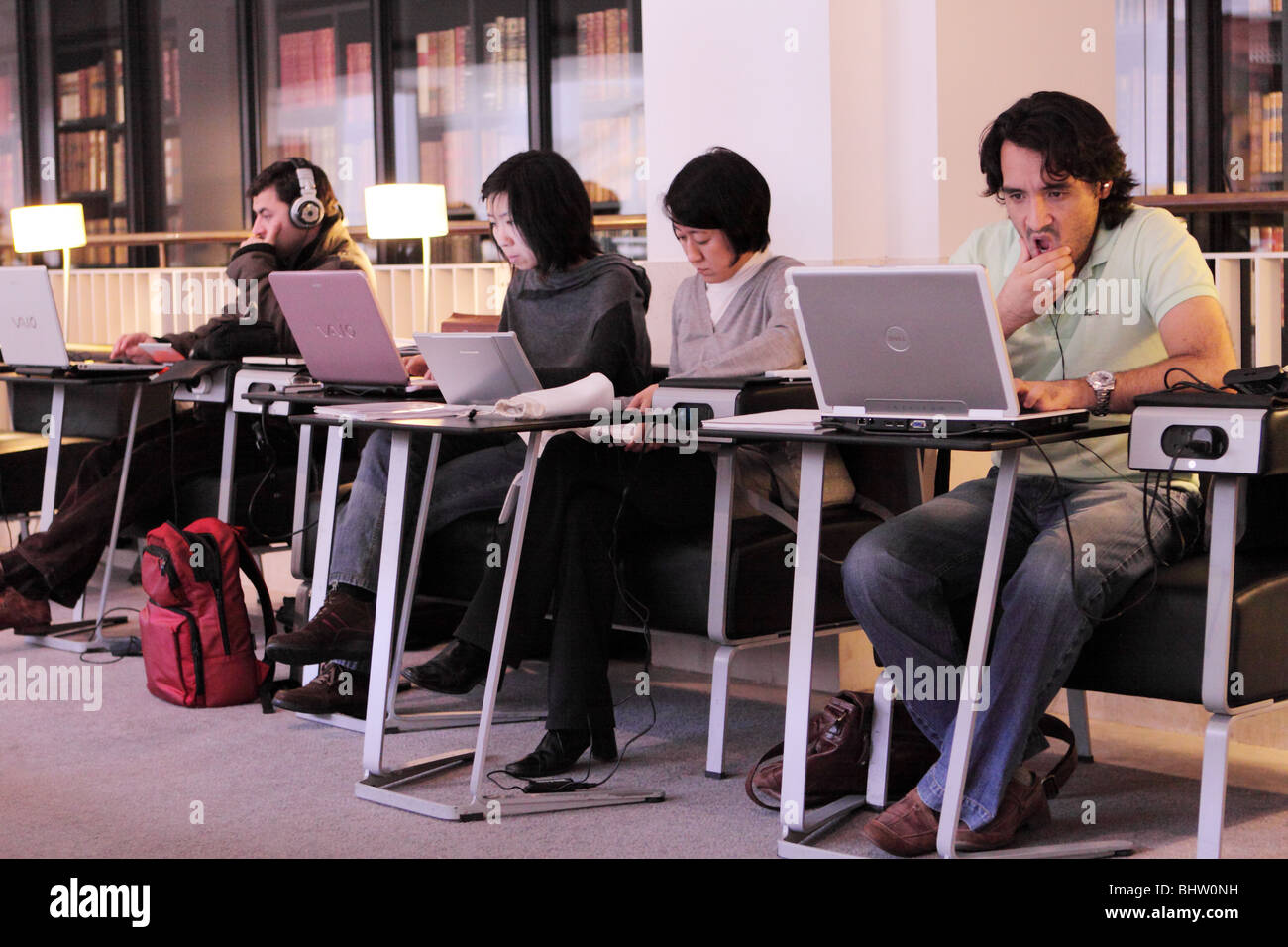 The British Library in Euston London students using portable laptop