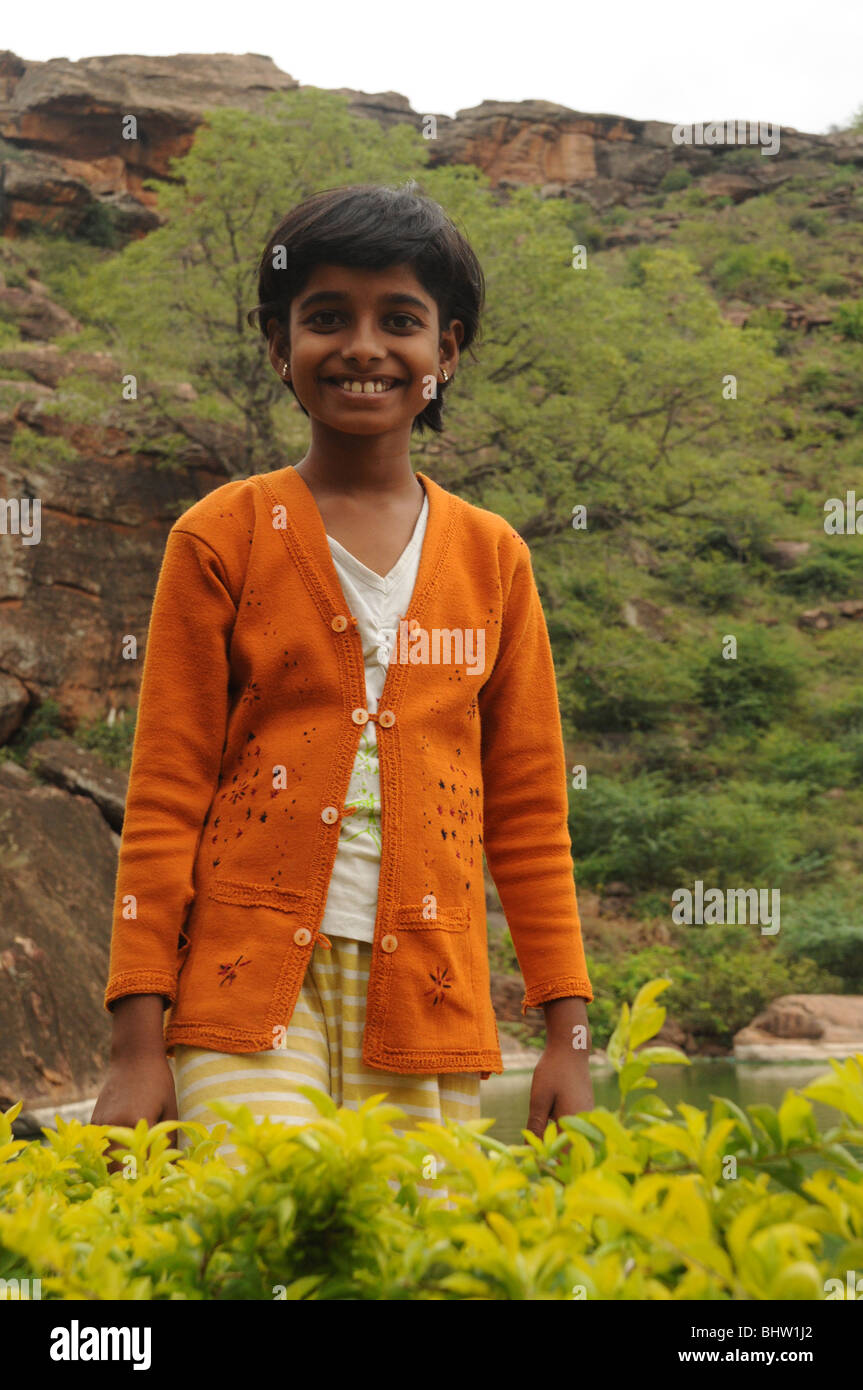 young girl in orange cardigan Stock Photo Alamy