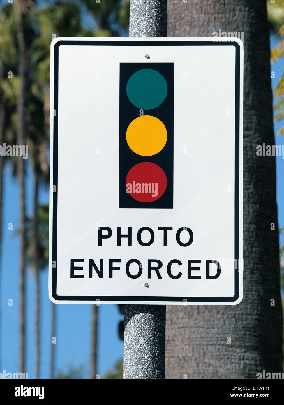 Photo Enforced traffic light warning sign in sunny Beverly Hills California. Stock Photo