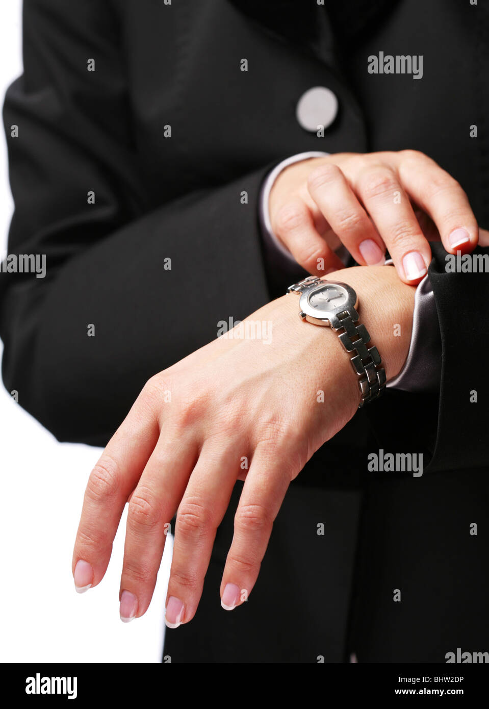 Businesswoman looks at her watch Stock Photo