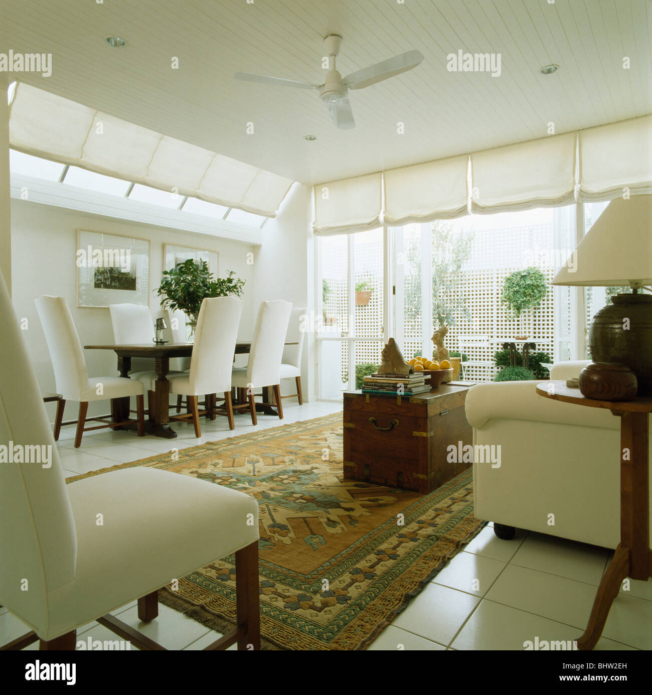 White High Back Upholstered Chairs And Dining Table In Modern
