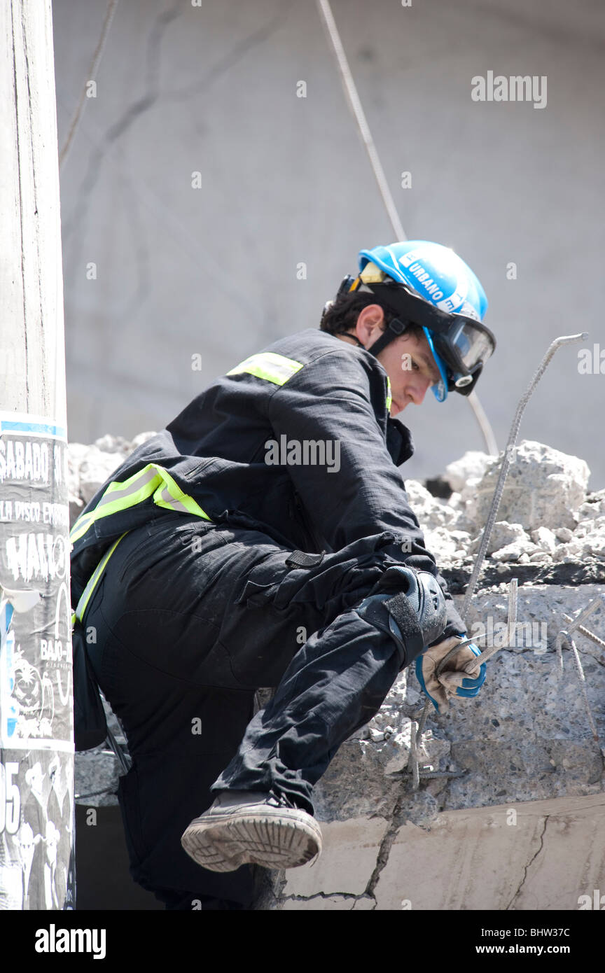 A Firemen Climbing on the ruins of the collapsed Highway, Americo Vespucio Norte. Stock Photo