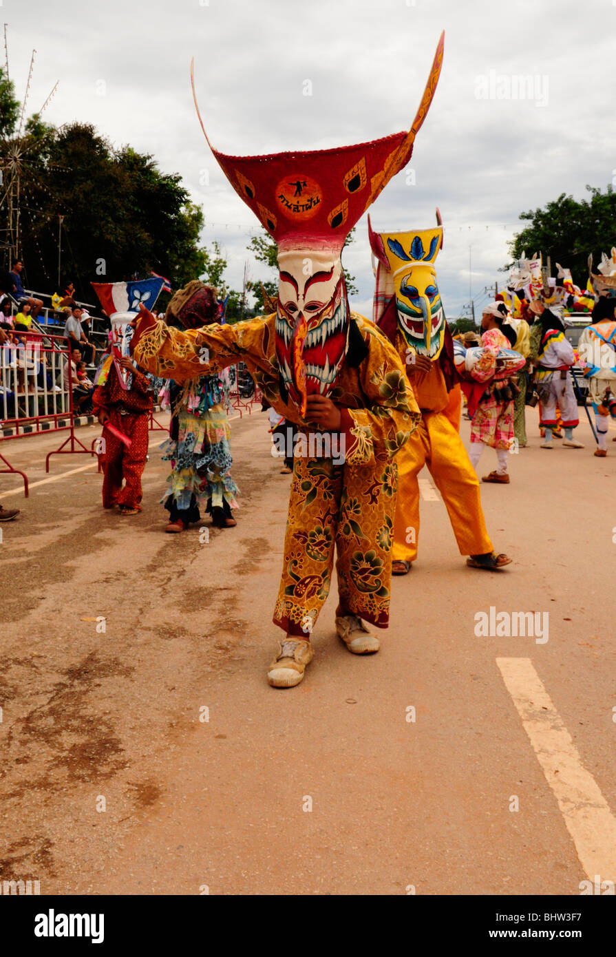 young boys in bizarre costumes and weird ghost masks , phitakon festival (phi ta khon) , dansai , loei , thailand Stock Photo