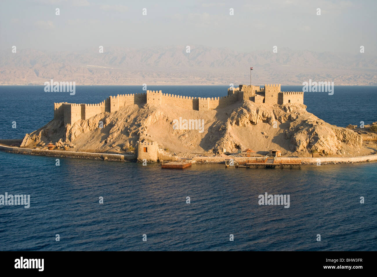 Crusaders citadel on Pharaoh's Island at sunset, offshore of the eastern Sinai Peninsula in Egypt. Stock Photo