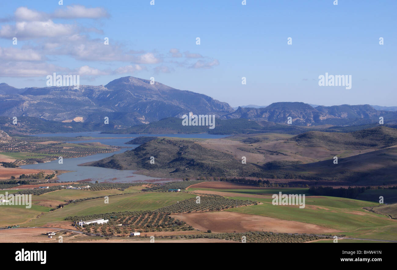 PANORAMIC VIEW FROM TEBA CASTLE AND TOWER ANDALUCIA SPAIN WITH VIEW OF SPANISH LAKE DISTRICT WITH MOUNTAINS IN THE DISTANCE AND FIELDS OF OLIVES Stock Photo